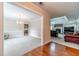 Inviting living room with hardwood floors, a brick fireplace, and access to the adjacent dining room at 1419 Gates Mill Walk, Lawrenceville, GA 30045