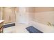 Elegant bathroom with a separate shower, soaking tub, and white tile walls at 1419 Gates Mill Walk, Lawrenceville, GA 30045