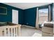 Charming Bedroom featuring a crib, a changing table, and a window at 217 Limestone Cir, Conyers, GA 30013