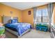 Comfortable bedroom with a bed, a window, and a toy organizer at 217 Limestone Cir, Conyers, GA 30013