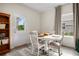 Charming dining area with a cozy table, chairs, and natural light, creating a welcoming space for meals and gatherings at 217 Limestone Cir, Conyers, GA 30013