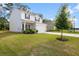 Charming two-story home featuring a well-manicured lawn and inviting front entrance with a two car garage at 217 Limestone Cir, Conyers, GA 30013