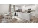Bright kitchen with white cabinetry, stainless steel appliances, and a spacious island, creating a functional and stylish cooking space at 217 Limestone Cir, Conyers, GA 30013