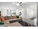 Open-concept living space with hardwood floors, comfortable seating, and abundant natural light, perfect for relaxing and entertaining at 217 Limestone Cir, Conyers, GA 30013