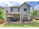 Exterior view of home with a covered patio and landscaped backyard at 2275 Black Pebble Cir, Buford, GA 30519