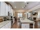 Open kitchen featuring white cabinetry, stone countertops, and an island that offers seamless access to living areas at 2275 Black Pebble Cir, Buford, GA 30519