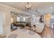 Open-concept living space with coffered ceilings, fireplace, a comfortable seating area, and adjacent kitchen at 2275 Black Pebble Cir, Buford, GA 30519