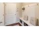 Mud room with built-in storage and seating, hooks for coats, and convenient access to the home's entrance at 2275 Black Pebble Cir, Buford, GA 30519
