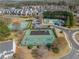 Aerial view of community amenities includes a playground, basketball court, tennis court, and pool at 3420 Griffin Way, Cumming, GA 30040