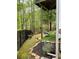 Lush backyard featuring a privacy fence, swing, and abundant trees at 3420 Griffin Way, Cumming, GA 30040
