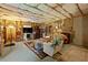A finished basement featuring a carpet, exposed ceilings, and comfortable decor at 3420 Griffin Way, Cumming, GA 30040