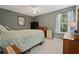 Cozy bedroom featuring a ceiling fan, one window with curtains, and comfortable neutral carpet at 3420 Griffin Way, Cumming, GA 30040