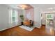 Cozy dining room with hardwood floors and natural light from the window at 3420 Griffin Way, Cumming, GA 30040