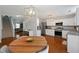 Bright kitchen with stainless steel appliances and wooden island table at 3420 Griffin Way, Cumming, GA 30040