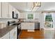 Modern kitchen with granite countertops and access to the outdoor deck at 3420 Griffin Way, Cumming, GA 30040
