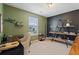 Stylish home office with dark walls and a built-in shelving unit at 3420 Griffin Way, Cumming, GA 30040