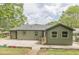 The backyard is spacious and showcases the back of the house with its fresh paint and trim at 525 Rosemont Dr, Decatur, GA 30032