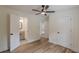 Bedroom with bathroom and closet doors and a ceiling fan at 525 Rosemont Dr, Decatur, GA 30032