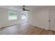 Bedroom featuring a modern ceiling fan, hardwood floors, and neutral walls at 525 Rosemont Dr, Decatur, GA 30032