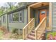 Close-up showcasing the inviting new front door, porch, and front yard landscaping at 525 Rosemont Dr, Decatur, GA 30032