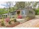Charming single-story home with an inviting entrance, lush landscaping, and fresh exterior paint at 525 Rosemont Dr, Decatur, GA 30032