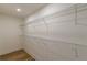 Walk-in closet features wire shelving and wood flooring at 525 Rosemont Dr, Decatur, GA 30032