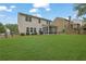 Large, well-maintained backyard with a screened-in patio and privacy fence at 6240 Vista Crossing Way, Cumming, GA 30028