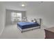 Bedroom with plush carpet, a sunny window with blinds, and soothing wall color at 6240 Vista Crossing Way, Cumming, GA 30028