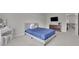 A spacious bedroom features a large window and neutral walls and floors at 6240 Vista Crossing Way, Cumming, GA 30028