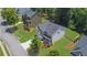 View of a two-story home with a well-manicured lawn, a two-car garage, and lush landscaping at 6240 Vista Crossing Way, Cumming, GA 30028