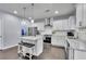 Modern kitchen featuring stainless steel appliances, a center island with seating, and bright white cabinetry at 6240 Vista Crossing Way, Cumming, GA 30028