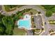 Aerial view of a community pool with vibrant features including a kiddie pool, lap pool, and sunbathing loungers at 6240 Vista Crossing Way, Cumming, GA 30028