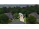 An aerial view of a home with a long driveway, two-car garage and mature trees at 1444 Merrifield Ln, Marietta, GA 30062