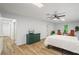 Bright bedroom with wood floors, a bed, dresser, and a window with natural light at 1444 Merrifield Ln, Marietta, GA 30062