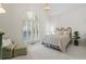 Vaulted bedroom with a light fixture and a window with custom shutters at 1444 Merrifield Ln, Marietta, GA 30062