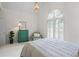 Bedroom with a colorful accent table, neutral walls, carpet, and a window at 1444 Merrifield Ln, Marietta, GA 30062