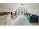 Large bonus room with a couch and built in shelving at 1444 Merrifield Ln, Marietta, GA 30062