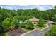 Community playground, pool, clubhouse, and parking surrounded by lush greenery at 1444 Merrifield Ln, Marietta, GA 30062