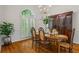 This dining room features hardwood floors, a large window, and a dining room table at 1444 Merrifield Ln, Marietta, GA 30062