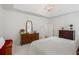 This main bedroom has tray ceilings, carpeted floors, and is brightly lit at 1444 Merrifield Ln, Marietta, GA 30062