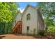 Two-story home featuring stairs, large arched windows and light siding at 1444 Merrifield Ln, Marietta, GA 30062