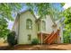 Two-story home featuring stairs, large arched windows and light siding at 1444 Merrifield Ln, Marietta, GA 30062