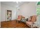 Cozy sitting room with hardwood floors, comfortable chairs, and natural light at 1444 Merrifield Ln, Marietta, GA 30062