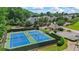 Community tennis courts surrounded by lush greenery at 1444 Merrifield Ln, Marietta, GA 30062