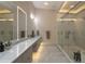 Elegant bathroom features a dual shower, luxurious vanity, and impeccable neutral color palette at 2746 Emerald Dr, Jonesboro, GA 30236