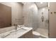 Modern bathroom featuring a marble vanity with waterfall faucet and glass-enclosed shower at 2746 Emerald Dr, Jonesboro, GA 30236