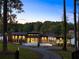 Secluded modern home, nestled among mature trees, features a private driveway and lake access at 2746 Emerald Dr, Jonesboro, GA 30236