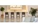 Modern kitchen features a center island and barstool seating at 2746 Emerald Dr, Jonesboro, GA 30236