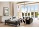 Bright and airy living room with soaring ceilings, a modern fireplace, and beautiful lake views at 2746 Emerald Dr, Jonesboro, GA 30236