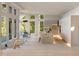Open concept living area with modern kitchen, large windows, and hardwood floors at 2746 Emerald Dr, Jonesboro, GA 30236